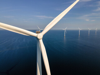 Wind turbine from an aerial view, windmill farm in the lake IJsselmeer the biggest in the...