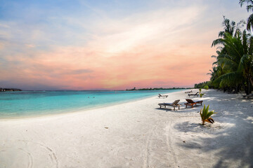 Maldives (Maldive) island beach. tropical landscape, white sand with palm trees. Luxury travel resort. Exotic beach view, amazing nature.