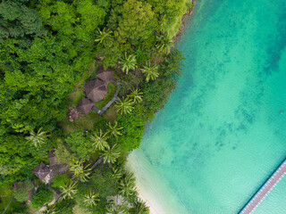Aerial view sea beach wave white sand beach with green tree forest