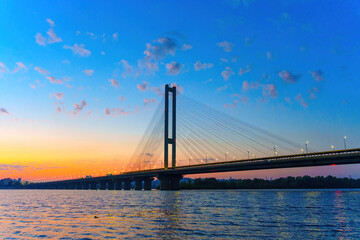 Dnipro River Twilight: Illuminated Southern Bridge