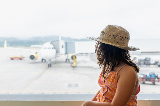 Girl at modern airport during vacation