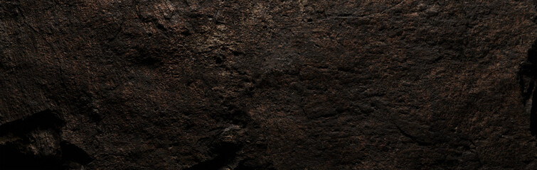 Brown stone texture, dark abstract background. Natural mineral rock close up details, empty...