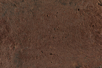 Brown stone texture, dark abstract background. Natural mineral rock close up details, empty backdrop with copy space for design