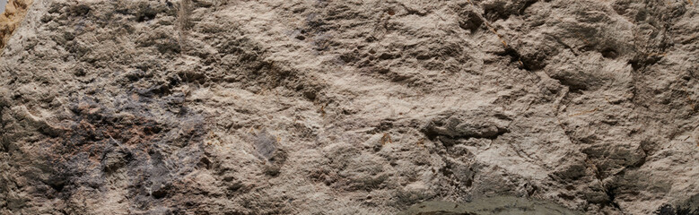 Gray stone texture, dark abstract background. Natural mineral rock close up details, empty backdrop with copy space for design