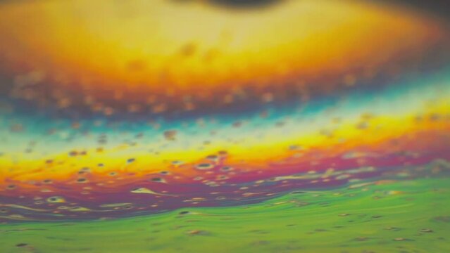 Abstract colorful swirls and gradients in a fluid art pattern.