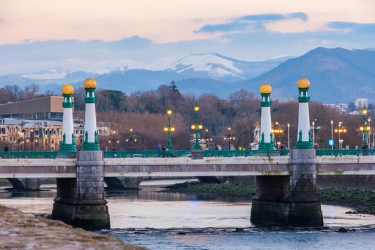 View of Kursaal zubia Bridge in San Sebasti&aacute;n, Spain, with the range of mountains in the background.