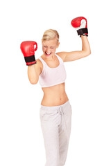 Woman, boxer and success for fight winner, achievement and victory match by white background in studio. Person, athlete and boxing champion in celebration for fitness, workout and exercise training