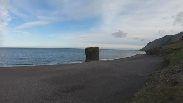 Stapinn sea stack at Stapav&iacute;k is a unique part of the stunning coast south of &Aacute;lftafj&shy;&ouml;r&eth;ur in Iceland.