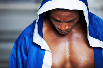 Black man, robe and boxing champion getting ready for fight, challenge or sports competition at gym...