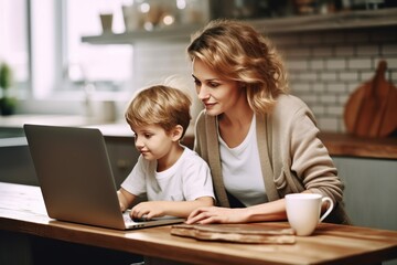Fototapeta na wymiar mother and child boy using laptop