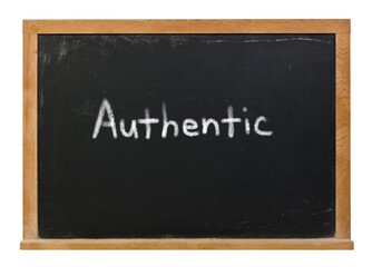 Obraz premium Authentic written in white chalk on a black chalkboard isolated on white