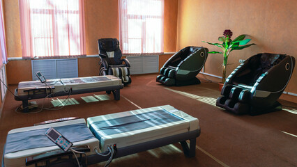 The massage chair is designed for hardware massage. Massage room for the treatment of people....