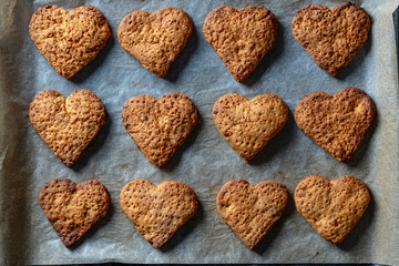 Home made heart shaped shortbread cookies on baking tray