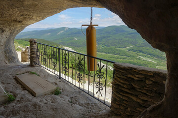 Ancient buildings cave fortress city Mangup-Kale, sunny day. Mountain view from the ancient cave...