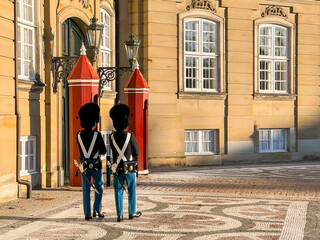 Traditional Danish ceremonial guards, soldier,  in palace Amalienborg in capital Copenhagen, with bright red guard house