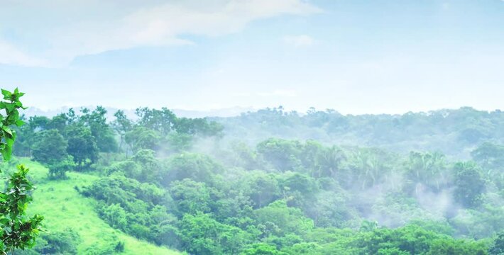 aerial video view of beautiful natural and misty green mountain views with wide spread slopes