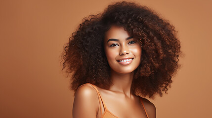 Hasselblad portrait photography of african american girl with clean healthy skin on beige background. Smiling dreamy beautiful black woman. Curly hair in afro style.