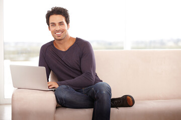 Man, work from home and portrait on laptop for stock market investment, planning and research on website and sofa. Startup freelancer or trader relax on a couch with his computer and trading software