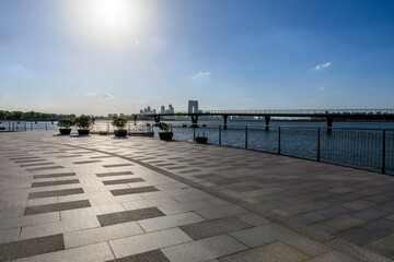 Pedestrian walkway and city skyline in Suzhou, China.