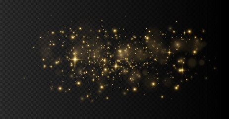 The light of gold dust, bokeh light effect background. Christmas glowing dust background, Yellow flickering glow with confetti bokeh light and particle motion. The dust sparks and golden stars shine.