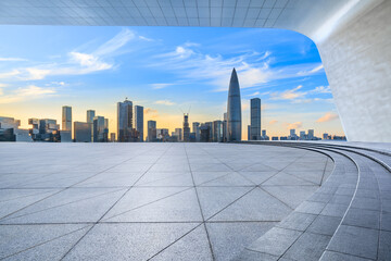 City square and skyline with modern buildings in Shenzhen at sunset, Guangdong Province, China....