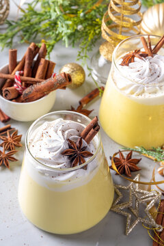 Creamy Homemade Eggnog Pudding, Musse Dessert in glasses, with whipped cream and spices, sweet Christmas traditional taste dessert