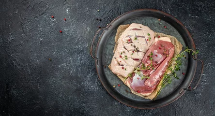 Deurstickers Raw duck meat breast with herbs and spices on a dark background. Long banner format. top view. copy space for text © Надія Коваль