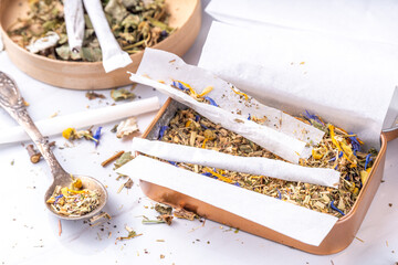 Alternative healthy herbal smoking blend. Handmade craft cigarette, preparation process, with...