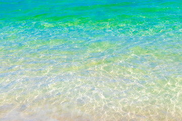 Waves at tropical beach caribbean sea clear turquoise water Mexico.