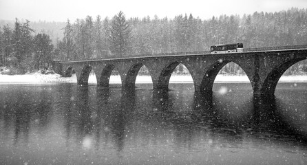 Sauerland winter panorama with bridge “Klamer Brücke“ at Versetalsperre, a fresh water...
