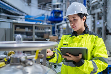 Asian engineer working at Operating hall,Thailand people wear helmet  work,He worked with diligence...