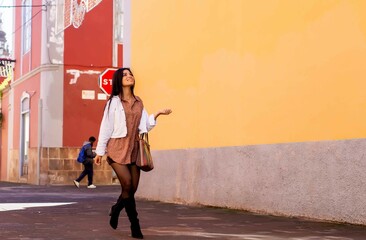 Young Hispanic Woman Walking Through Historic Streets Of Canary Islands