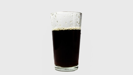 Soda in transparent glass isolated on a white background.