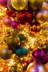 Christmas red and gold balls all with lights and bulbs lights on the Christmas tree.