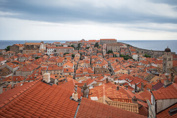 View to the red roofs of Dubrovnik Old town on cloudy summer day. 
