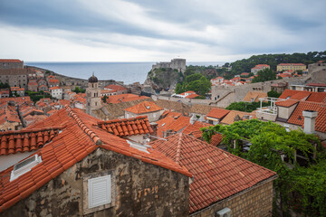 Fototapeta na wymiar View to the red roofs of Dubrovnik Old town on cloudy summer day. 