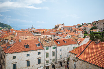 Fototapeta na wymiar View to the red roofs of Dubrovnik Old town on cloudy summer day.