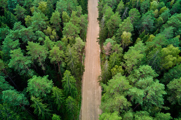Fototapeta na wymiar Aerial view of an empty forest road for cars to pass through