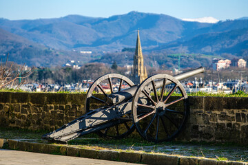 Antique cannon artillery defensive weapon at historic fort building Castillo de la Mota on Mount...