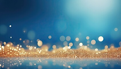 Fototapeta na wymiar Golden glittering confetti on blue background, sparkling gold dust