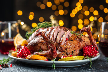 Whole roasted duck with oranges, berries and herbs. Dish for Christmas Eve. place for text