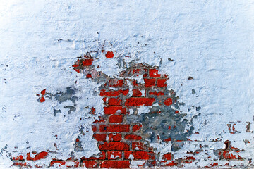 red brick wall painted white paint