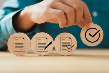 businessman hand putting wooden cube with approved document icons for business process workflow...
