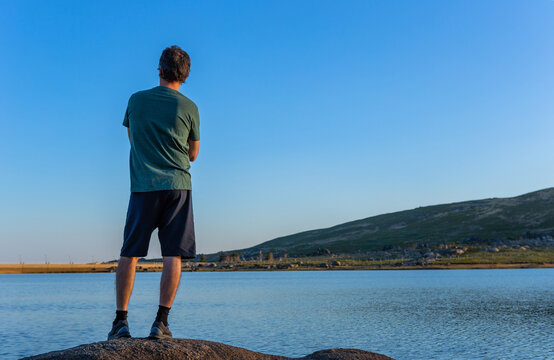 Man tourist standing overlooking the lake