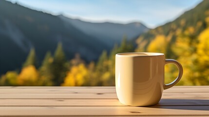 Close up of a light yellow Mug on a wooden Table in the Mountains. Blurred natural Background - obrazy, fototapety, plakaty