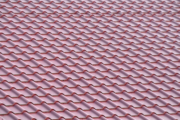 The roof of the house is covered with metal tiles