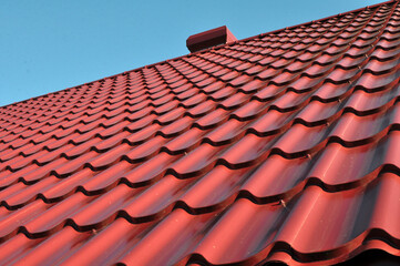 The roof of the house is covered with metal tiles