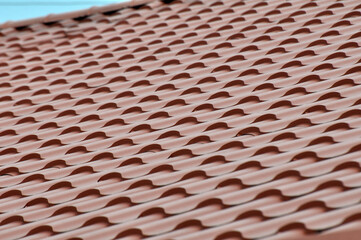 The roof of the house is covered with metal tiles
