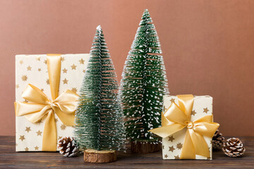 Christmas composition. craft Gift box, small tree, branches and craft DIY decorations on white background. New year concept. Christmas home decoration Flat lay, top view, copy space