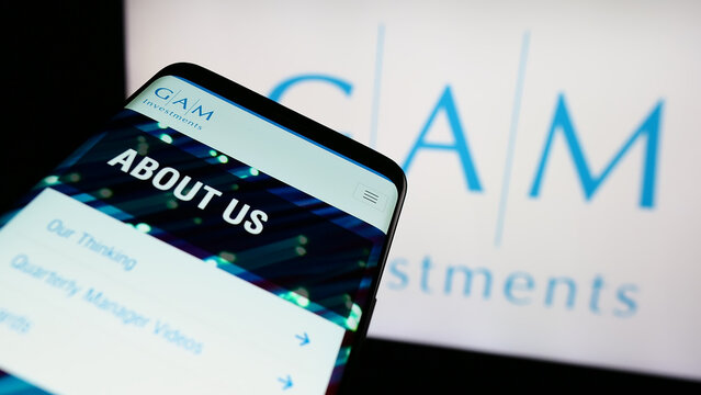 Stuttgart, Germany - 11-21-2023: Mobile phone with website of Swiss asset management company GAM Investments in front of business logo. Focus on top-left of phone display.